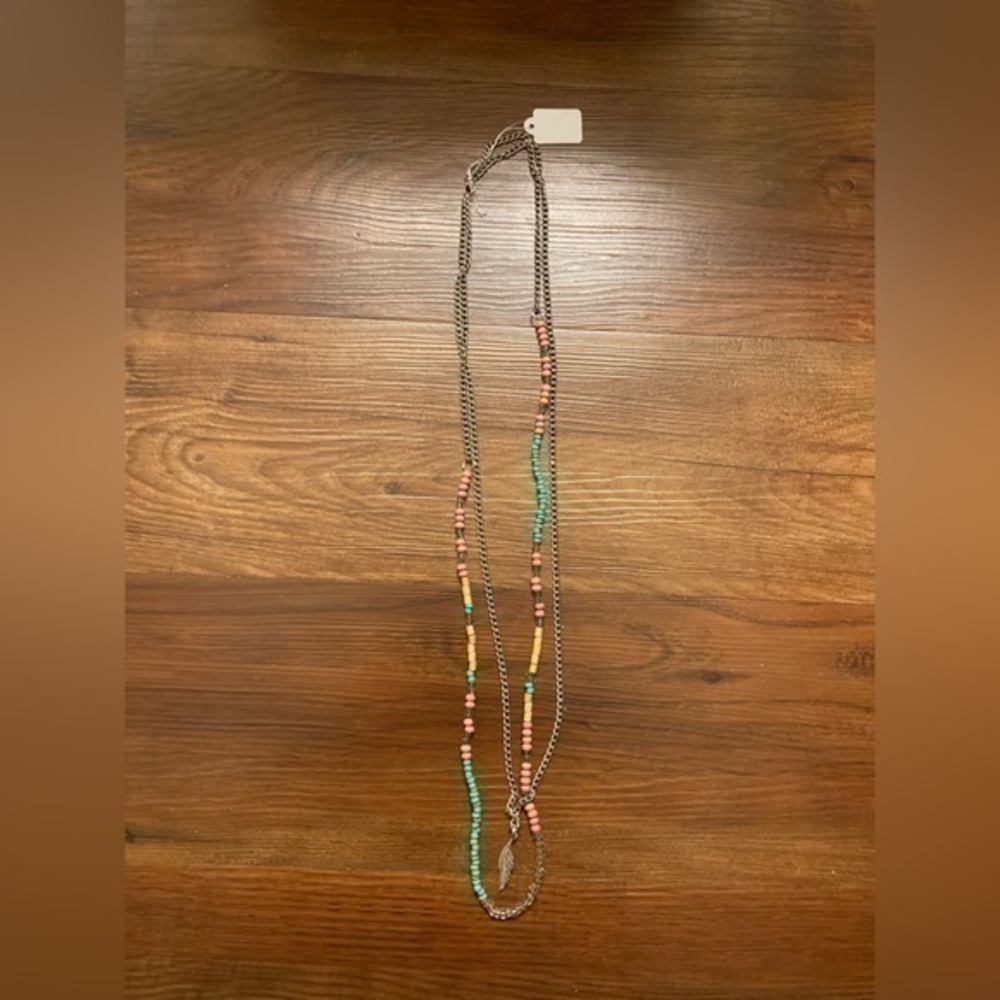 Silver tone beaded necklace with wooden, pink and turquoise colored bead…
